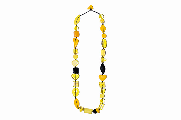 A Long Necklace Of Transparent And Opaque Yellow And Black Resin Mixed Shaped And Sized Beads