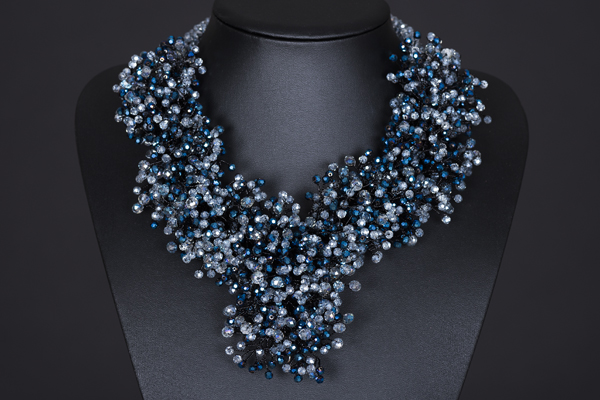 A Silvered Metal Wires Triangular Shaped Necklace Decorated With Mixed Blue Facetted Glass Beads