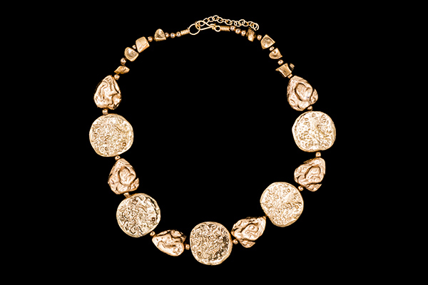 A Necklace Of Golden Metal Pitted Surface Discs And Nuggets With Golden Metal Small Round Spacers