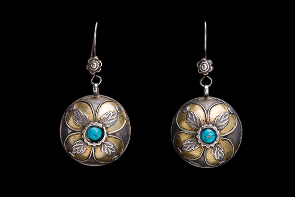A Pair Of Turkman Antique Silver Domed Circular Floral Patterned Earrings With A Turquoise Centre