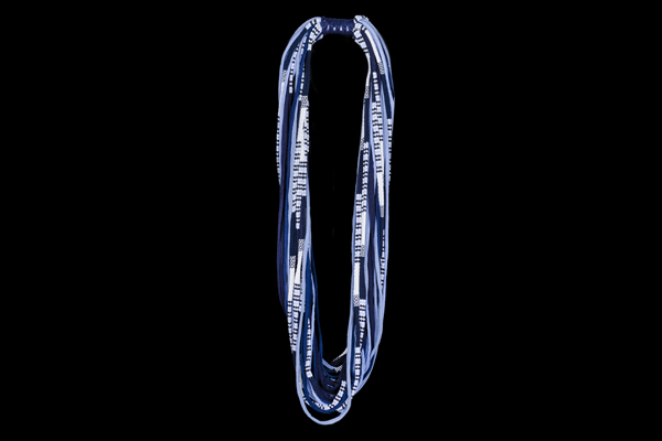 A Long Necklace Of Thirty-Three Blue And White Patterned Cotton Strands