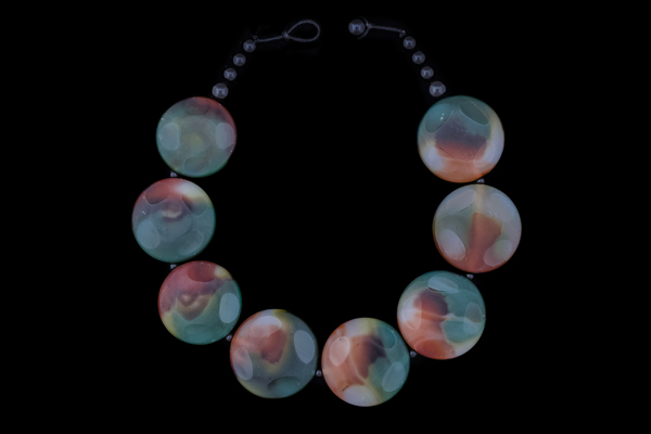 A Necklace Of Green And Orange Coloured Glass Large Circular Beads With Black Onyx Spacers