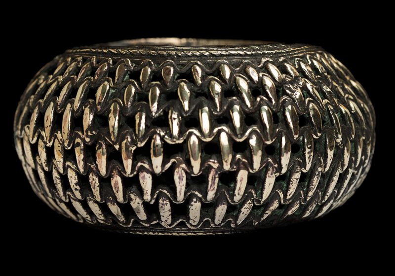 A Baule Brass Large And Wide Bangle With Six Patterned Bands