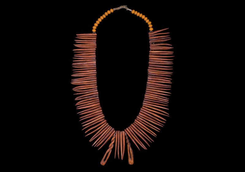 A Cameroon Long Necklace With One Hundred And Four Bone Pointed Drops And Twenty Orange Resin Beads