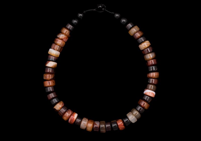 A Necklace Of Forty-Five Cornelian And Agate Circular Button Beads With Five Black Onyx Round Beads