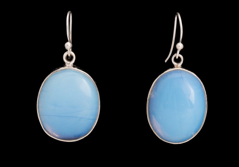 A Pair Of Silver Oval Drop Earrings Each Inlaid With An Opalite Glass Domed Oval Cabochon