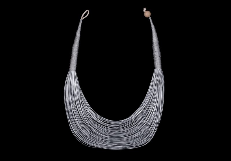 A Necklace Of One Hundred Silvered Cord Bands, Wrapped At The Tops With Silvered Metal Wires