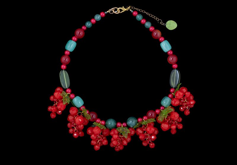 A Multicoloured Resin Beads Necklace With Pendants Of Red Resin Strawberries And Green Resin Leaves