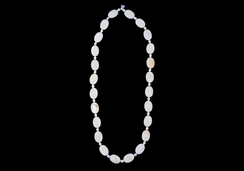 A Long Necklace Of White Mother-Of-Pearl Shell Oval Beads And Small White Shell Spacers