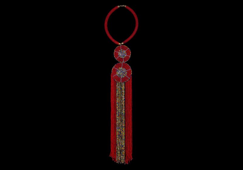 A Curved Band Necklace, Wrapped In Lines Of Small Red Resin Beads, And A Pendant Of Two Discs And Long Fringes, Decorated With Red And Multicoloured Resin Small Round Beads.