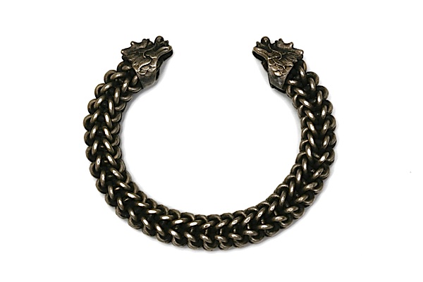 A Miao Silver Interlocking Loops Dragon's Heads Bangle