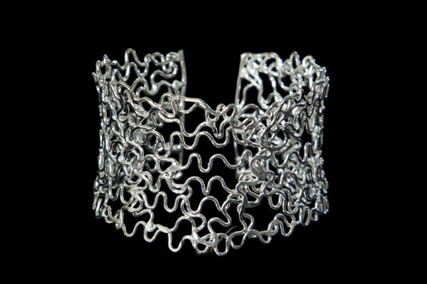 Silvered Metal Curled Interlocking Bands Open Cuff