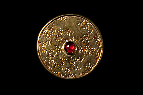 Brass Flat Circular Ring With A Garnet Centre