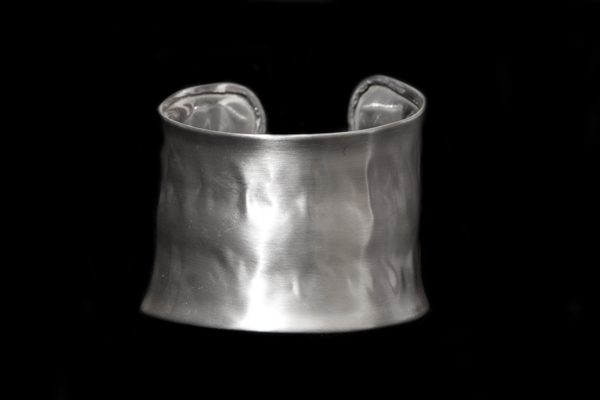 A Matt Silvered Metal Hammered Surface Open Cuff