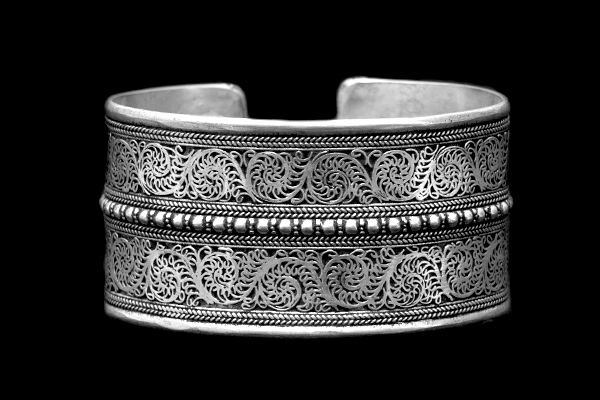 A Nepalese Silver Plated Filigree Patterned Ridged Open Cuff.