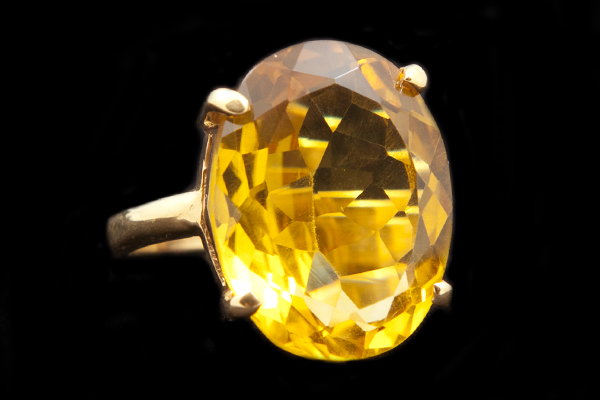 'Golden Citrine' Glass Oval Facetted Cabochon Set Onto A Gold Plated Ring