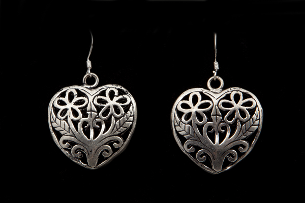 Silvered Metal Heart Shaped Drop Earrings Decorated With A Filigree Leaves And Flowers Pattern