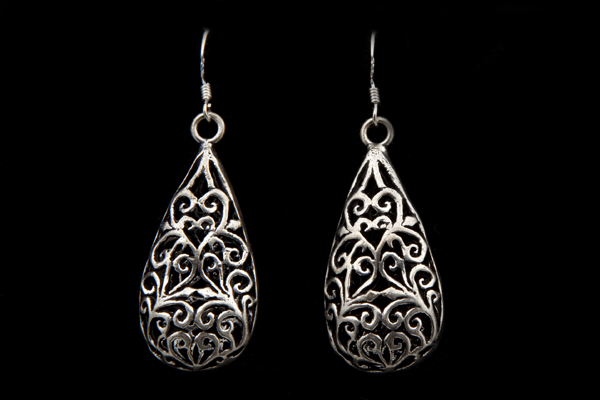 Silvered Metal Long Teardrops Earrings Decorated With A Filigree Scrolled Pattern