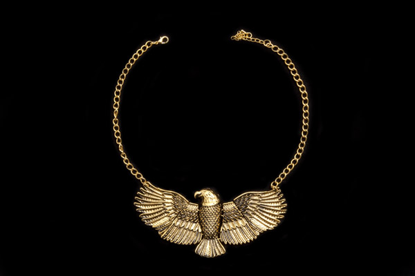 Golden Metal Eagle Pendant On A Golden Metal Chain Links Necklace