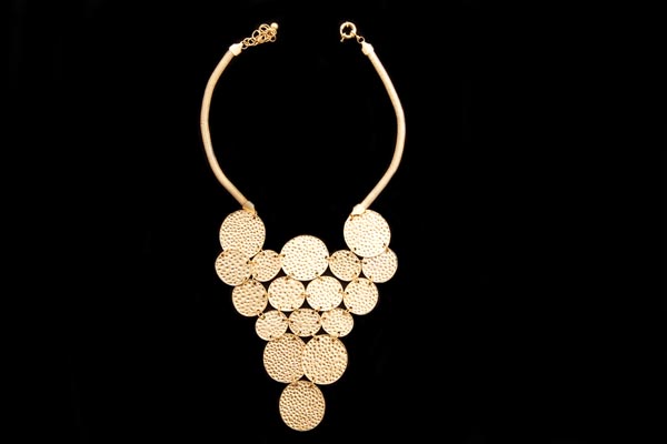 Seventeen Golden Metal Pitted Surface Circular Discs Triangular Shaped Pendant Necklace