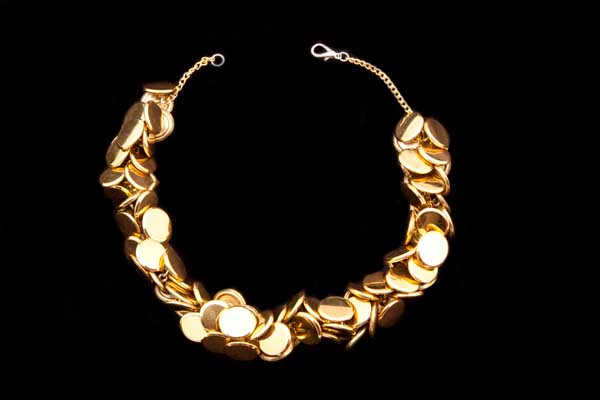 Golden Metal Circular Bunched Buttons Attached To A Golden Metal Chain Links Necklace