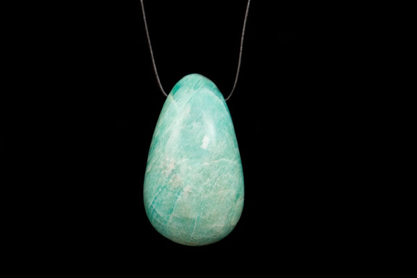 An Amazonite Large Smooth Teardrop Pendant Suspended From A Black Leather Thong Necklace