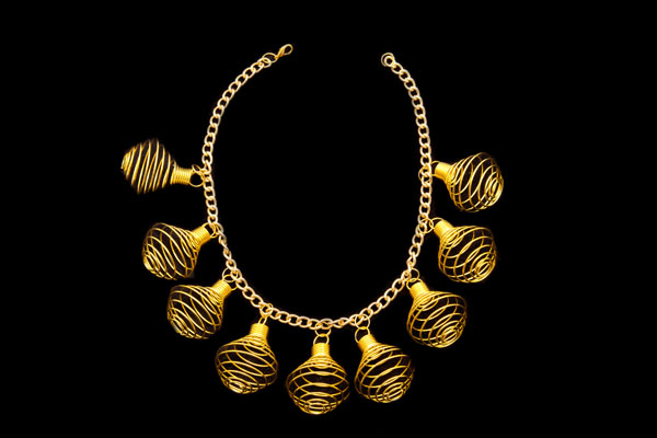 Golden Metal  Nine Coiled Bands 'Whisk' Drops  On A Golden Metal Chain Links Necklace