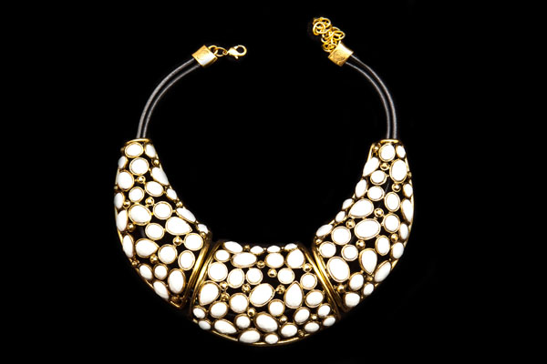 Golden Metal Three Curved Filigree Panels With White Glass Inlays On A Leather Thongs Necklace