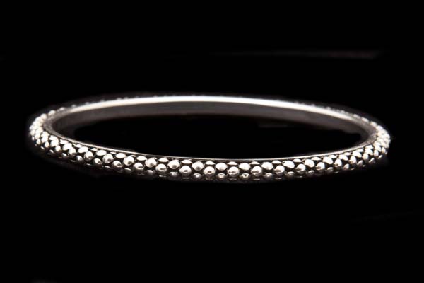 Silvered Metal Narrow Bangle Decorated With A Pattern Of Raised Circular Knobs