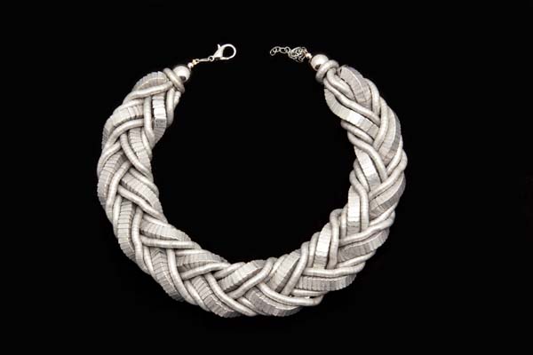 A Wide Choker Of Large And Small Matt Silvered Metal Interlocking Bendy Bands