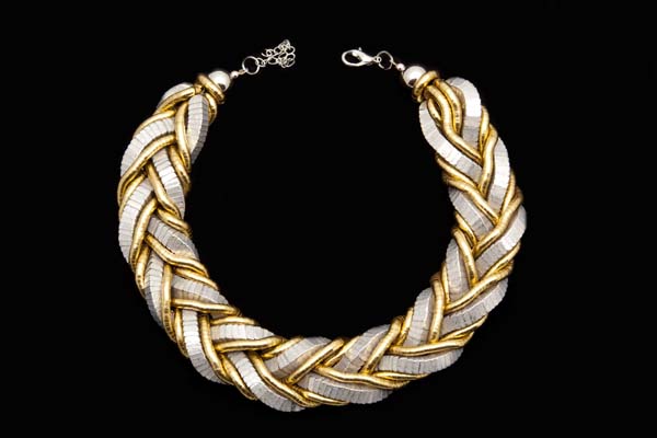 A Wide Choker Of Matt Silvered And Golden Metal Interlocking Wide And Narrow Bendy Bands