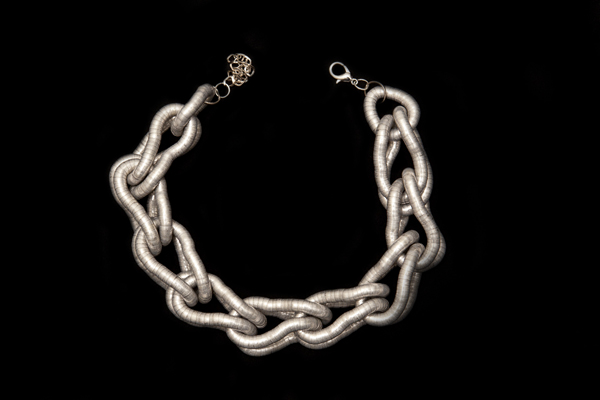A Large Double Loops Linked Necklace Of Silvered Metal Flexible Bands