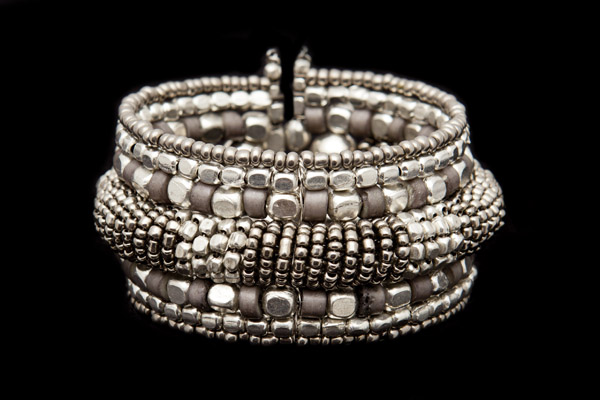 A Silvered Metal Open Cuff Decorated With Mixed Sized And Shaped Silvered Metal Small Beads
