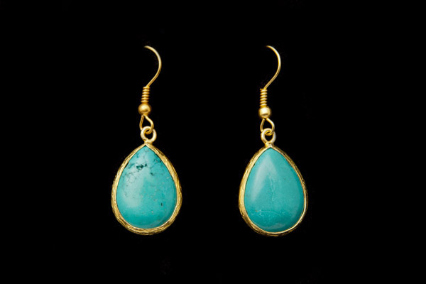 A Pair Of Turquoise Domed Teardrop Earrings With Gold Plated Hammered Surface Rims And Gold Plated Wire Hooks