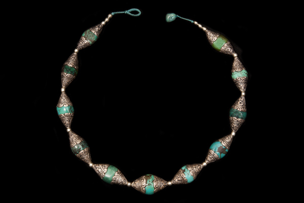 An Afghan Necklace Of Turquoise And Floral Patterned Silver Oval Beads With Silver Round Spacers