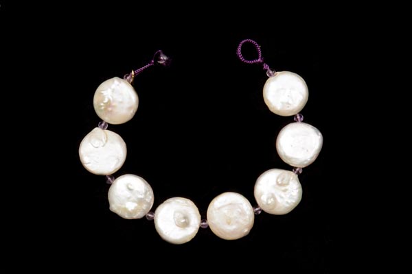 A Bracelet Of White Flat Baroque Freshwater Coin Pearls And Brazilian Amethyst Small Round Spacers