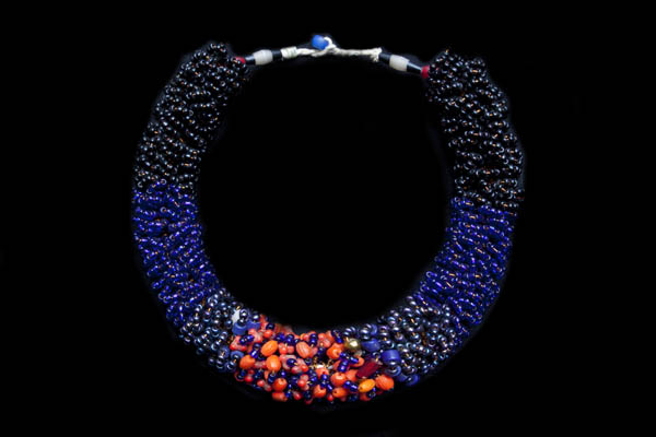 A Baule Tribe Necklace Of Dark Blue, Black, And Orange Glass Bunched Beads On Copper Wire Loops