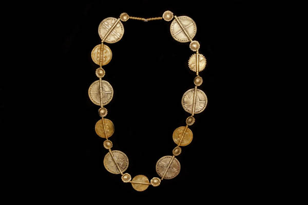 A Baule Tribal Long Necklace Of Mixed Sized  Brass Flat Circular Patterned Beads. Burkina Faso