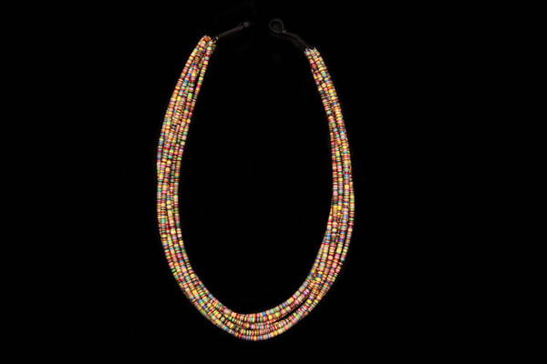 A West African Long Eight Strand Necklace Of Multicoloured Dyed Vinyl Thin Circular Discs