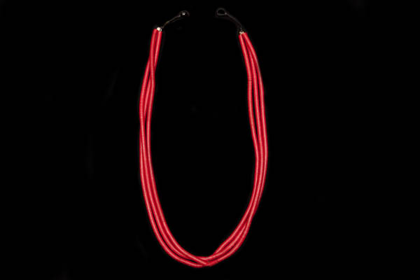 A West African Long Three Strand Necklace Of Red Dyed Vinyl Thin Circular Discs