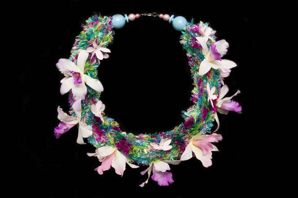 A Necklace Of Bunched Multicoloured Silk Threads, With Pink, Purple, And White Organza Flowers