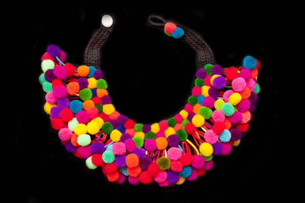 A Necklace Of Small Round Multicoloured Wool Pompom Drops, On A Brown Braided Cotton Band