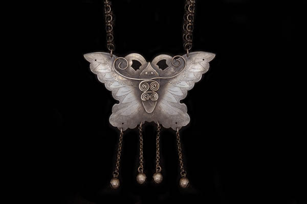 A Miao Silvered Metal Large Pendant Of A Stylised Butterfly, On A Silvered Metal Chain Necklace.