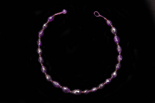 A Necklace Of Brazilian Amethyst Facetted Oval Beads With Garnet Round Spacers