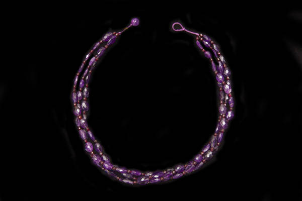 A Three Strand Necklace Of Brazilian Amethyst Facetted Oval Beads With Garnet Round Spacers
