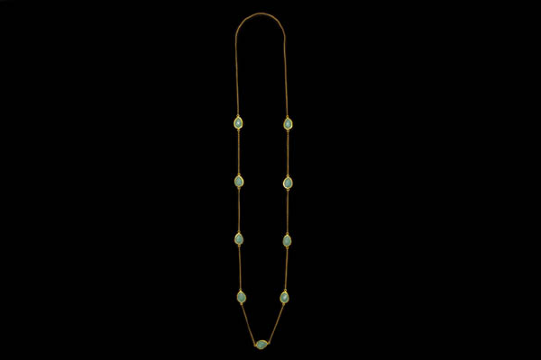 A Gold Plated Long Chain Necklace, Decorated With Nine Chalcedony Domed Facetted Teardrop Cabochons