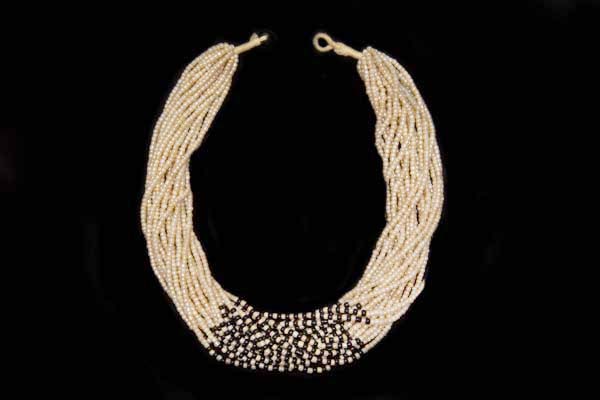 A Twenty Strand Necklace Of Small Pearlised And Black Glass Beads