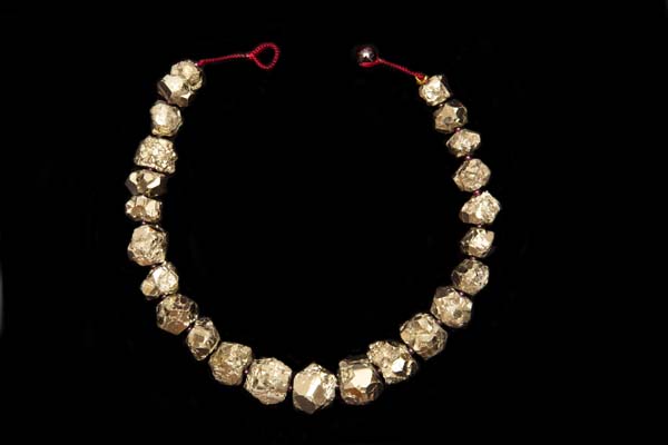 A Necklace Of Peruvian Pyrites Graduated Facetted Nuggets With Garnet Small Round Spacers