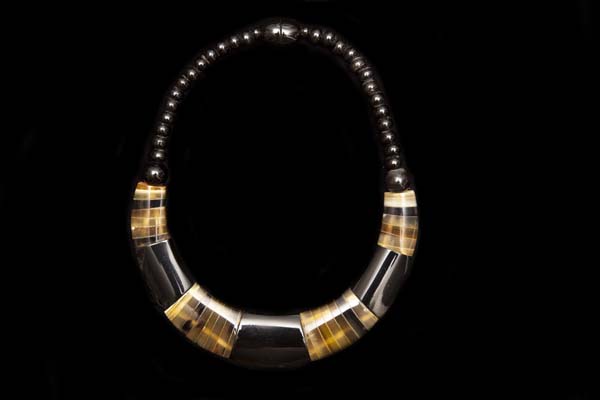 A Necklace Of Black And Brown Buffalo Curved Graduated Slices And Black Buffalo Horn Round Beads