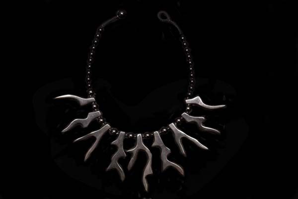 A Necklace Of Black Agate Round Beads With Nine Black Buffalo Horn Irregular 'Branches' Graduated Pendants